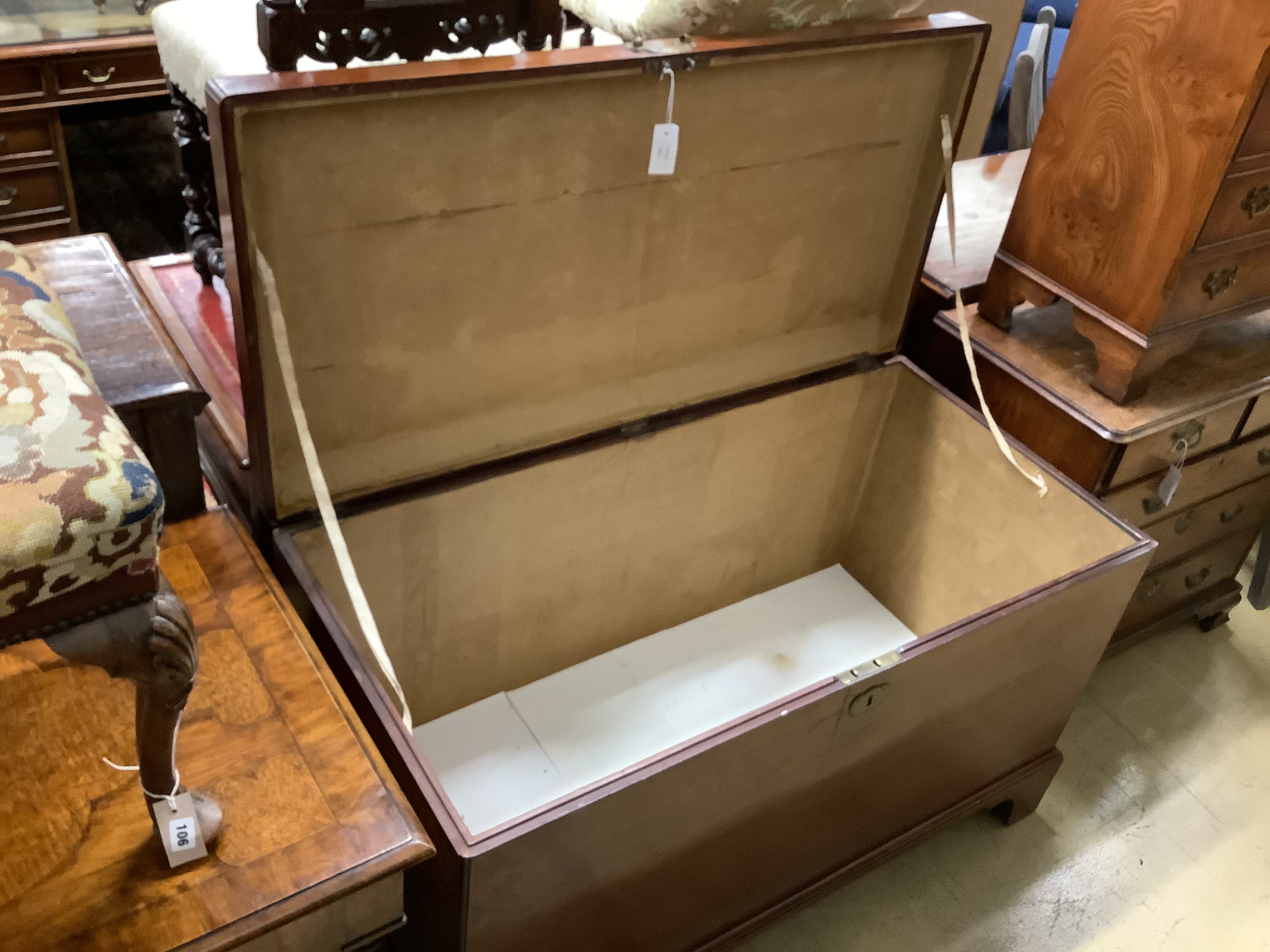 A George III mahogany coffer, with brass loop handles, on bracket feet (cracked), length 122cm, depth 60cm, height 76cm